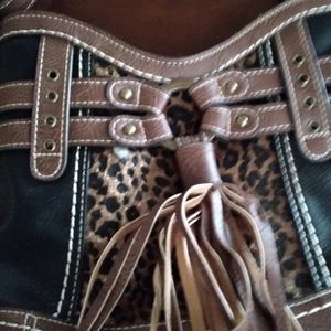 Brown and Black pocket book with cute fringes.